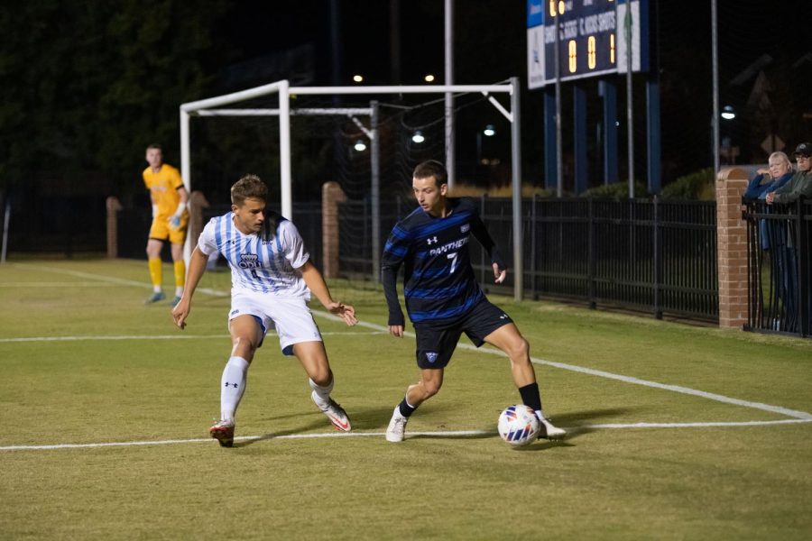 Freshman Fabian Rieser keeps his sight on the ball as he defends the Panther attack.