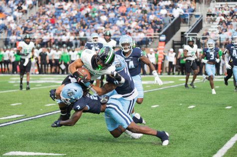 ODU sophomore defenders LaMareon James #2 and Deeve Harris #11 collide with the Marshall receiver on the play.
