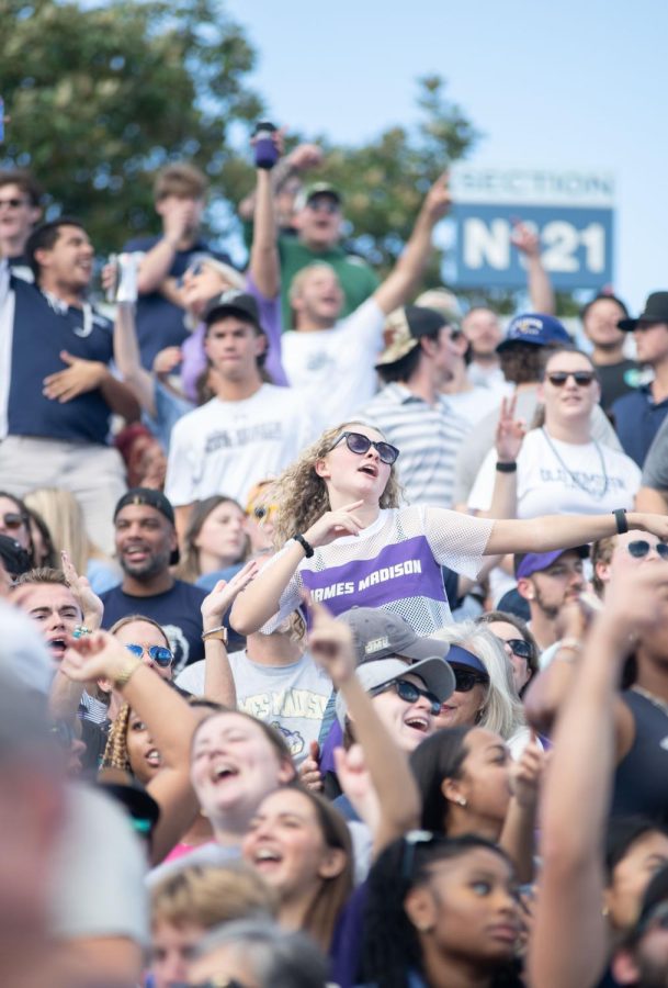 Both JMU and ODU fans alike enjoy the environment of the game as they sing along to a top hit. 