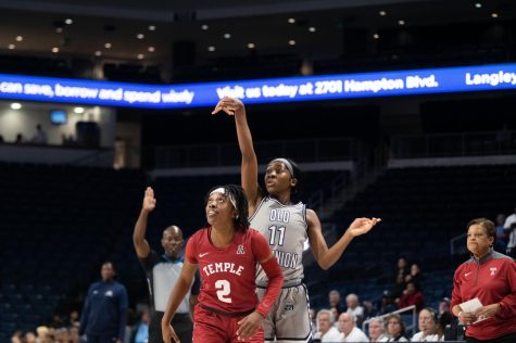 Senior guard Kaye Clark looks on after throwing up the three-point shot. 
