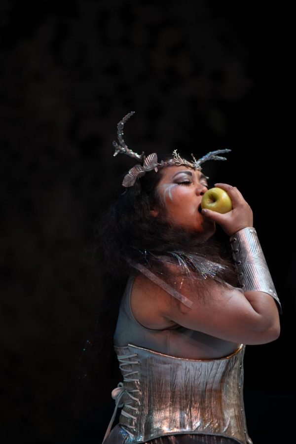 Anna Sosa is Artemis in “Artemis, I.” Artemis bites an apple as her goddesses recount the events leading up to the Trojan War. 