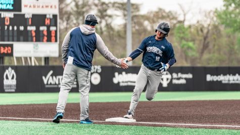Touch em all! Junior catcher Robbie ONeal trots around third base after blasting his two-run HR over the left-field wall in game two against ULM. 