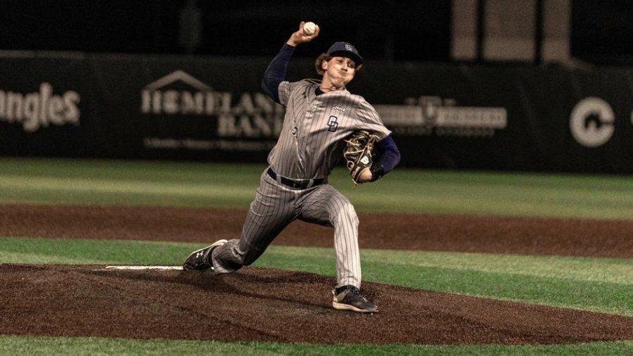 Sophomore RHP John Holobetz winds up for the pitch in game one against ULM. 