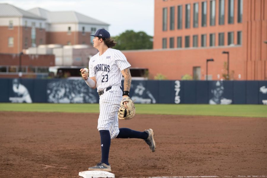 Junior Hunter Fitz-Gerald tags first base after the ground ball was hit in his direction in game one against Coastal.