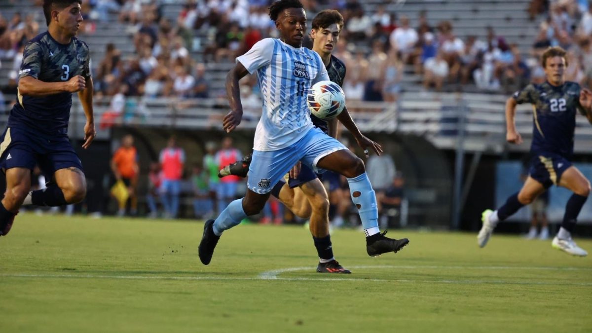Graduate forward Key White shows off his speed as he makes his way into the opposing penalty area. 