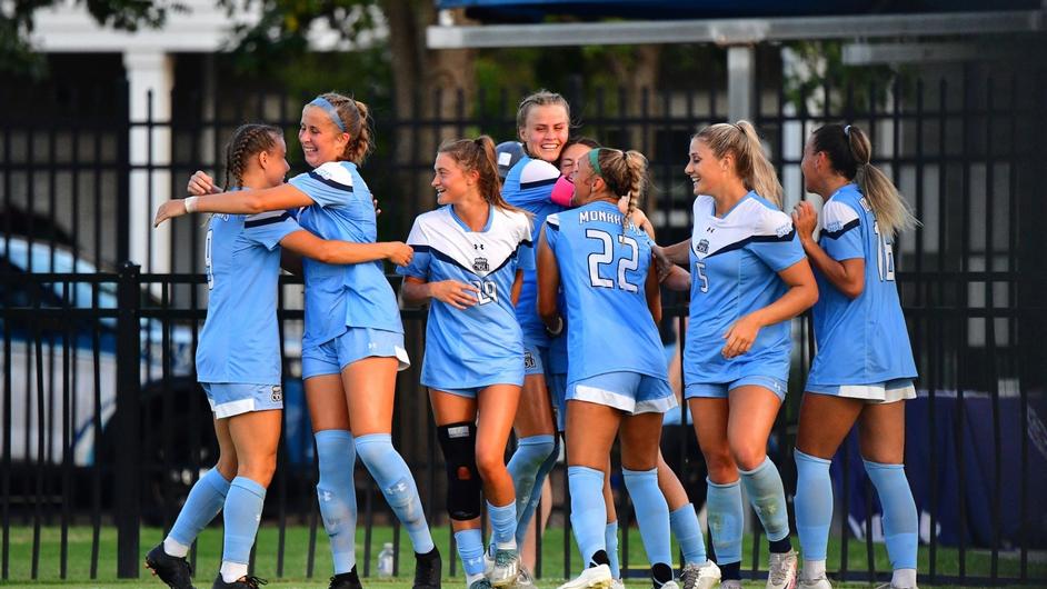 The+Lady+Monarchs+celebrate+after+netting+a+goal+against+Campbell.+