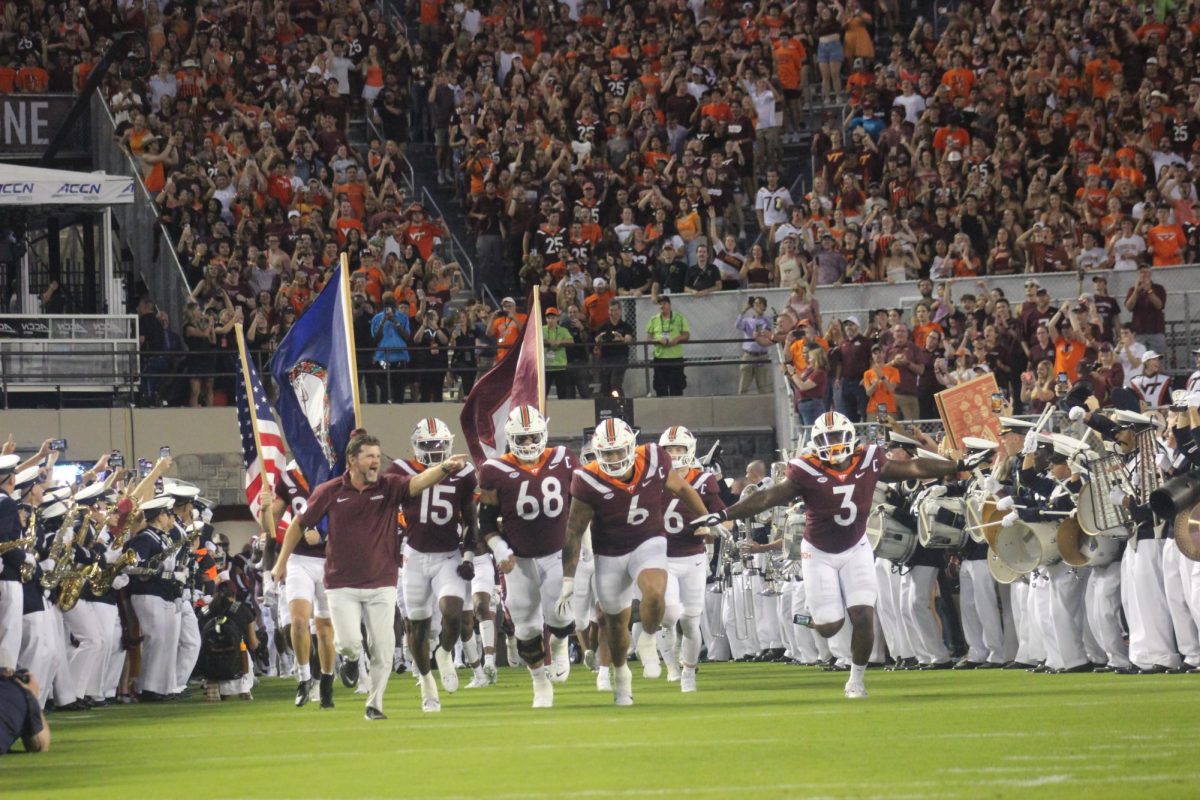 The Hokies are welcomed into Lane Stadium to their traditional Enter Sandman by Metallica. 