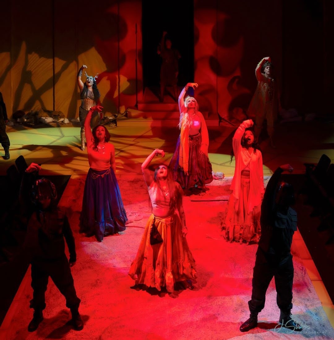 The cast of “Women of Troy” performing choreography. From left to right: Adrian Rivera, Reicse Owen, Tahji McCombs, Brooke Mullins, Jen Weir Edwards, MK Martéy, Anna Sosa, Joshua Moore.