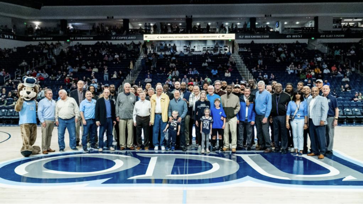 ODU+mens+basketball+Alumni+take+the+court+to+pose+for+a+group+photo.
