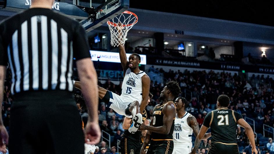 R.J. Blakney throws down the powerful one-handed slam in matchup against Mountaineers. 