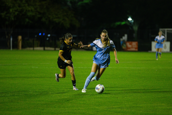 Sophomore midfielder Riley Mullen tracks the ball in fixture against ULM. 