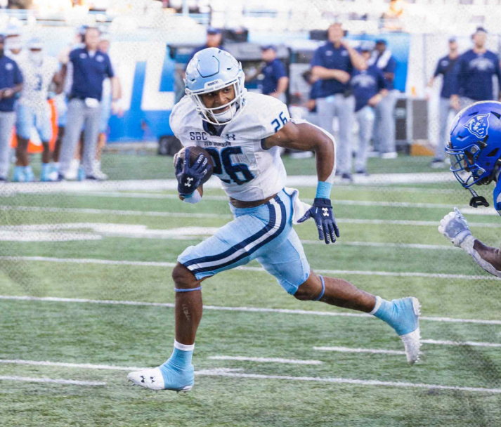 Junior RB Tariq Sims stares down his defender as he waltz his way into the end zone. 