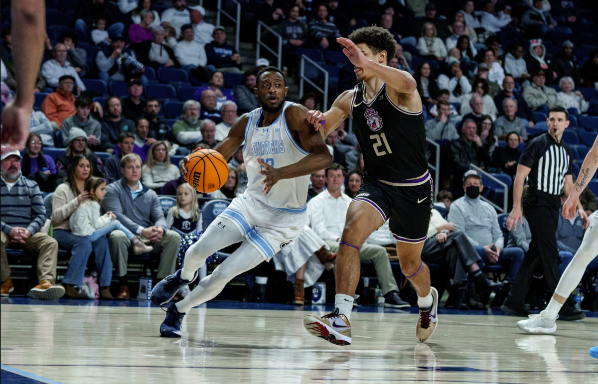 Senior R.J. Blakney drives to the basket in matchup against the Dukes on Wednesday night. 