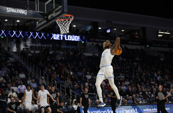 Senior R.J. Blakney throws down the powerful two-handed slam dunk against the Bobcats on Wednesday night. 